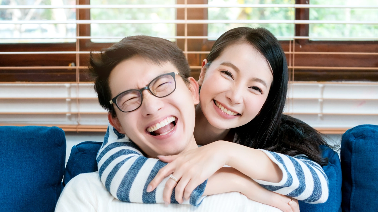 A couple laughing together.